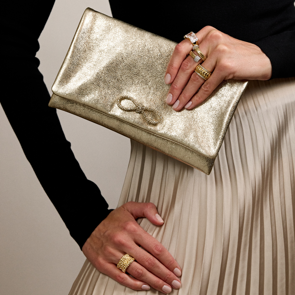 Merrichase gold clutch with crystal bow