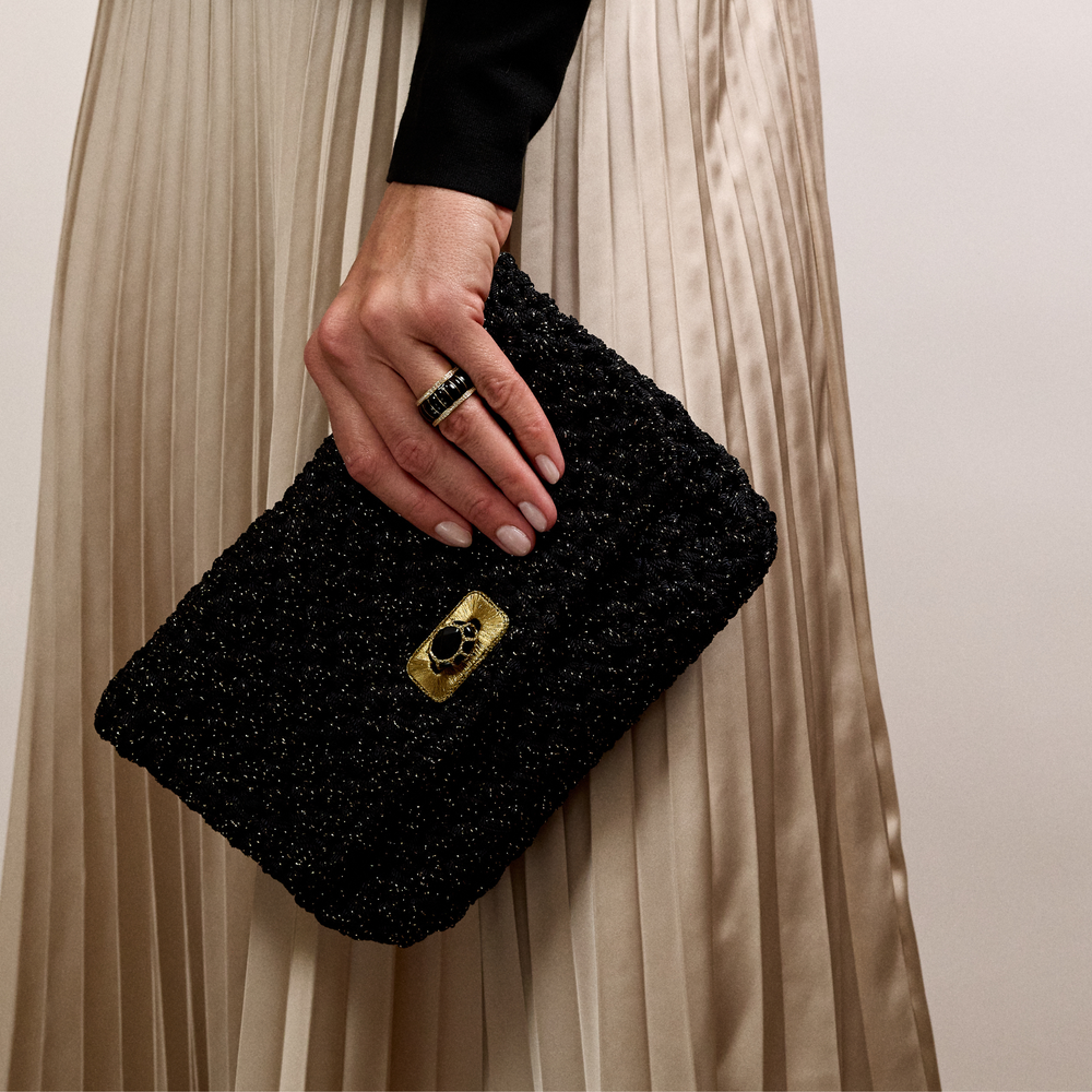 Merrichase woven clutch in black and gold